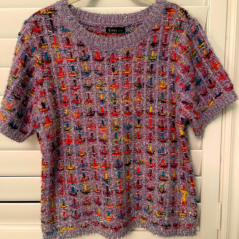 Adorable tweed like sweater top. Perfect for the holiday season!